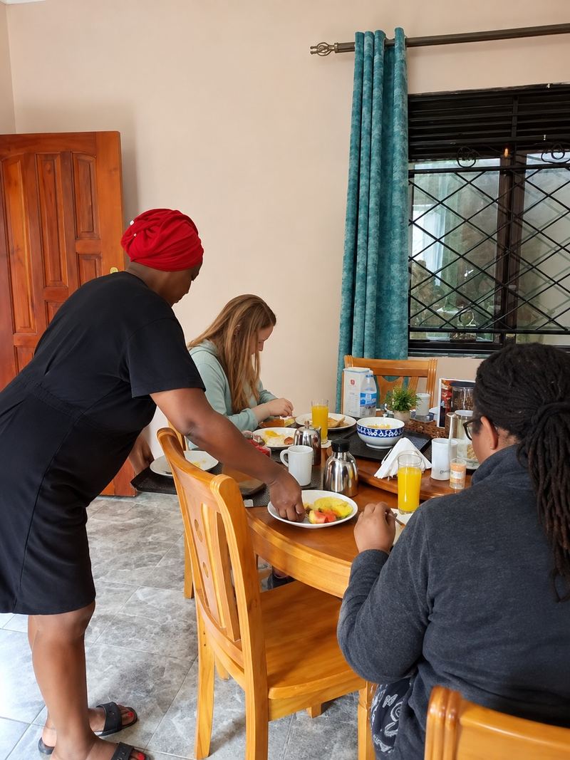 Staff serving breakfast to guests in the dining room