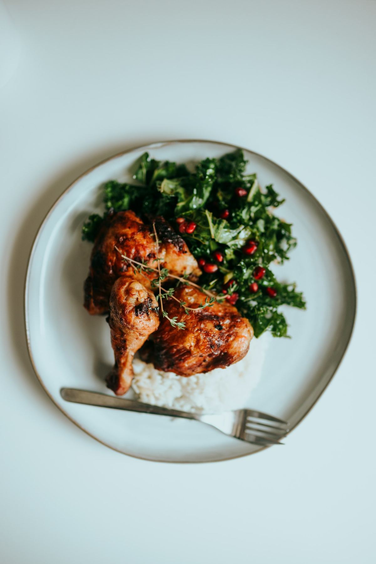 Roast chicken served with greens and rice